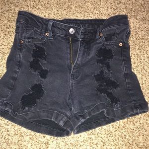 black american eagle jean shorts with rips